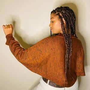 Crop sweater available in small, medium, or large.